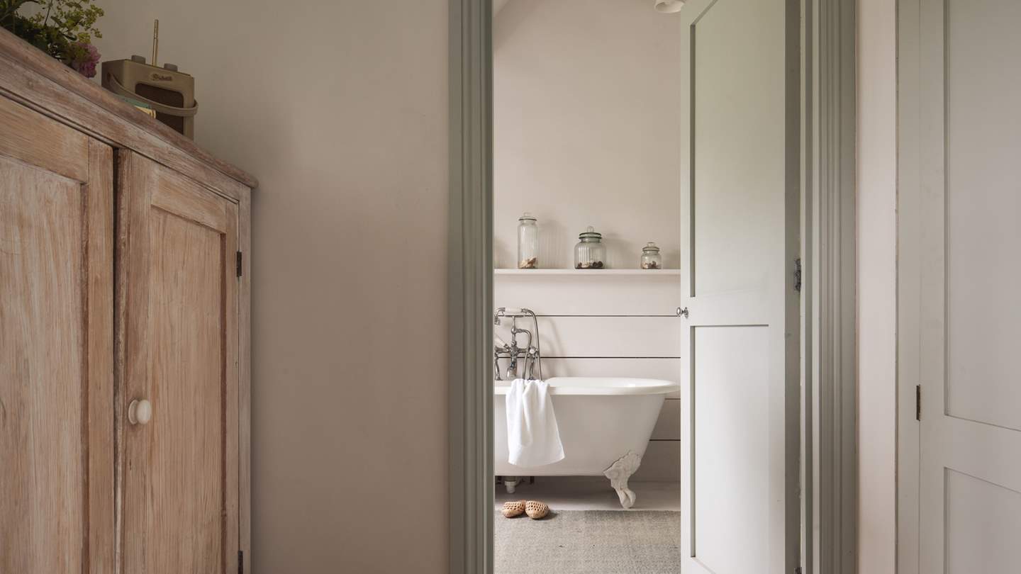 Through the dressing room you'll find the elegant en suite...