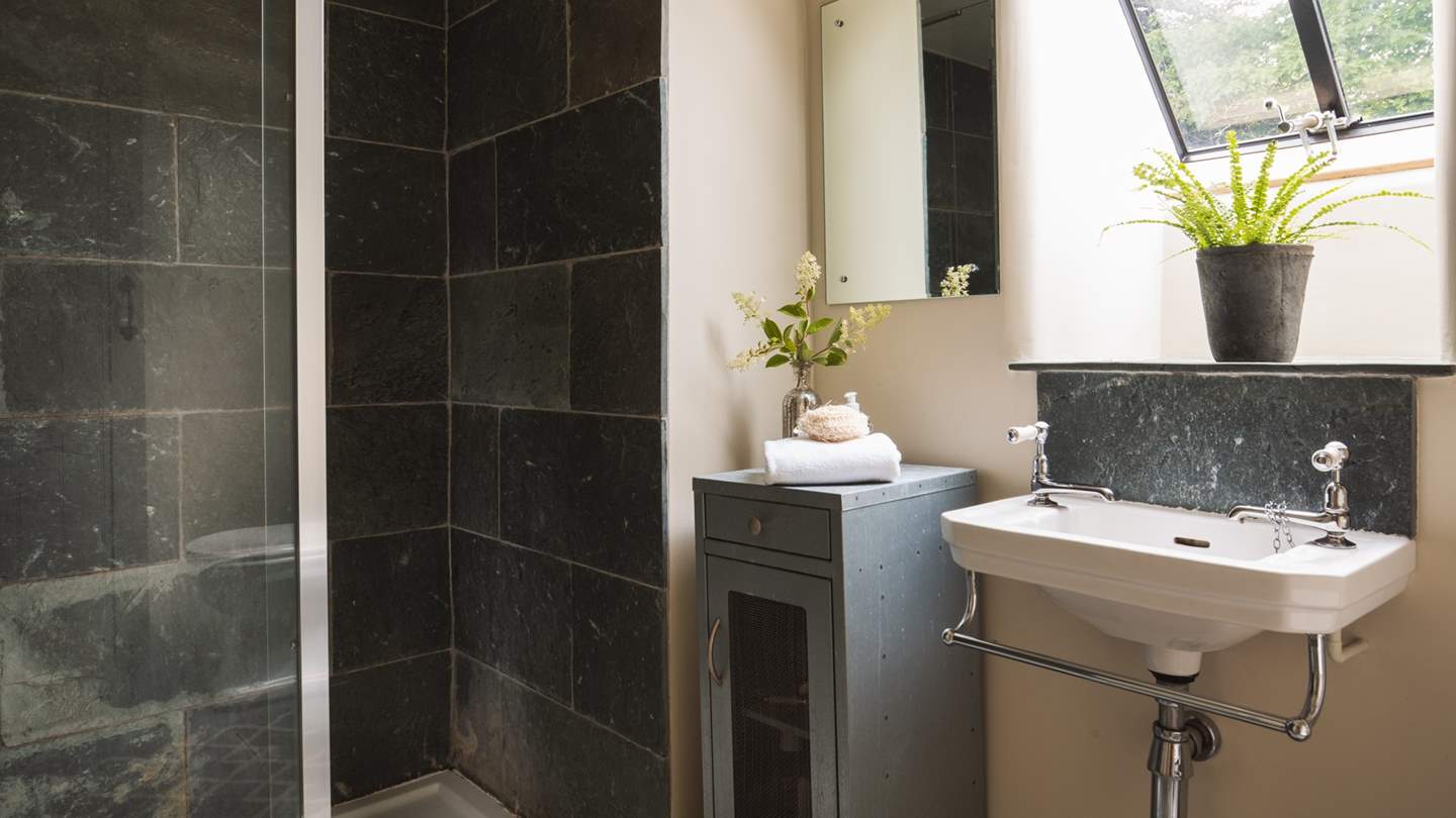 Rejuvenating showers await in the charcoal grey shower room