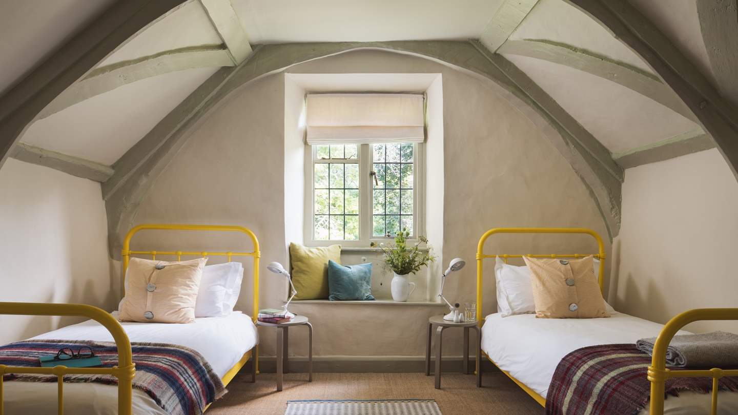 Verdant country views reside in the lovely third bedroom