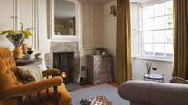 Cosy and charming, the petite sitting room is the perfect spot to return to at the end of the day