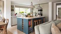 There's a  large central island for prepping food, whilst lots of space and a larder means there's plenty of storage