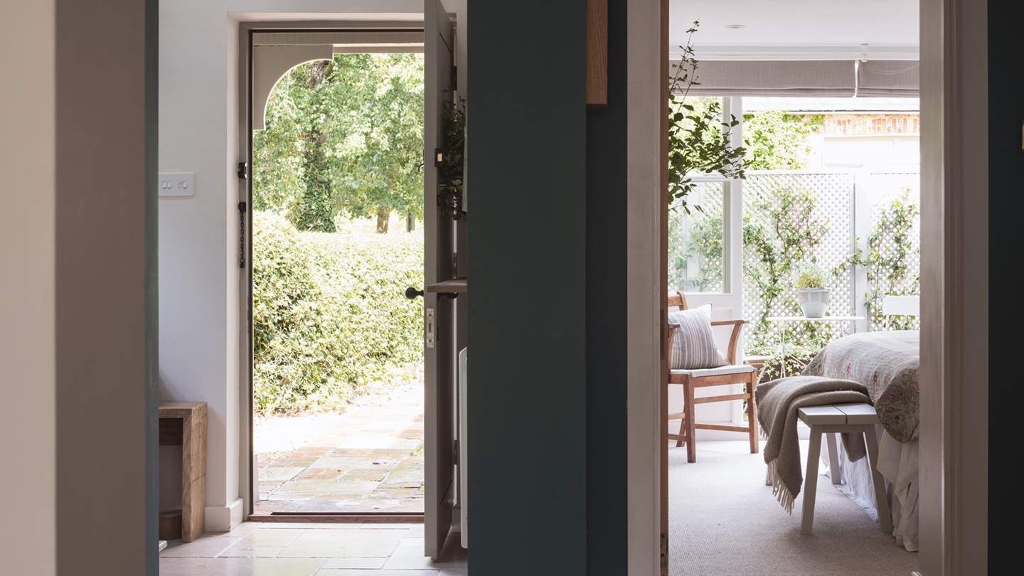 The third bedroom on the ground floor has huge French doors open on to your own private courtyard