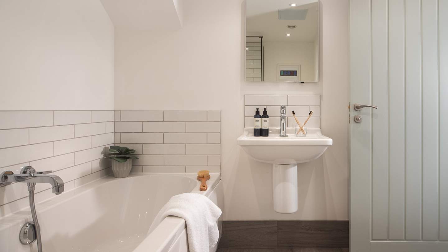 The family bathroom has a fabulously deep bath tub, perfect for long, leisurely soaks