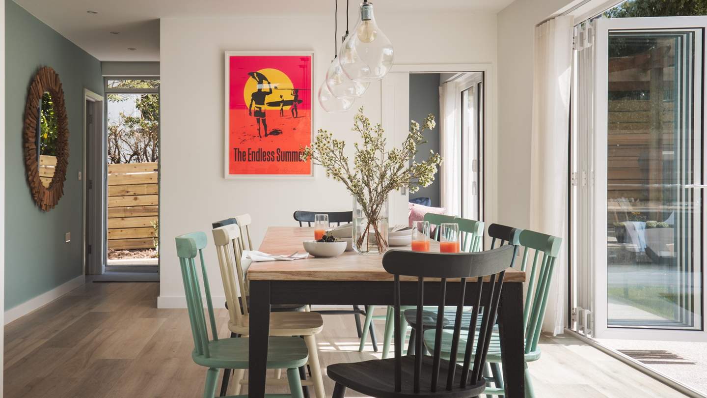 The huge wooden dining table easily seats ten and with gorgeous lighting overhead, it is the ideal spot for dinner parties and celebrations