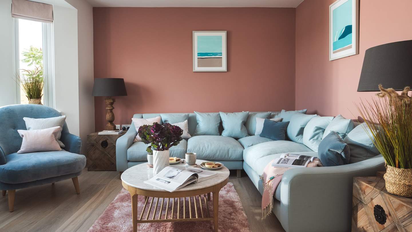 The dreamy, oh-so-grown up sitting room is shades of sweet pink and ocean-blue 