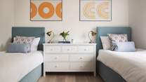 Perfect for little ones, we just love the colour scheme and artwork of this cute bedroom