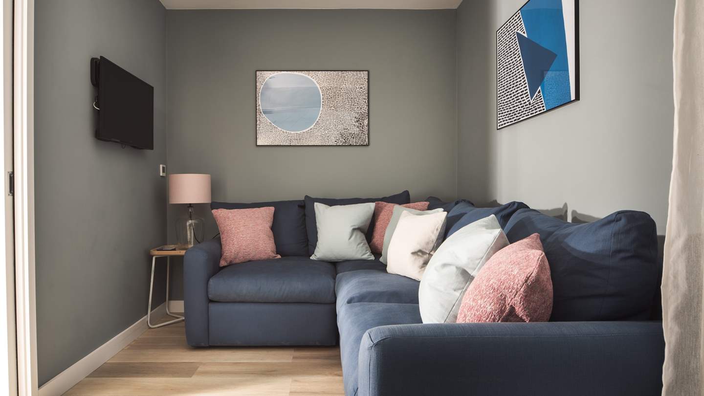 A cosy snug with plenty of seating and a Smart TV with Sky, Sky Sports and Netflix is the perfect hideout for little ones