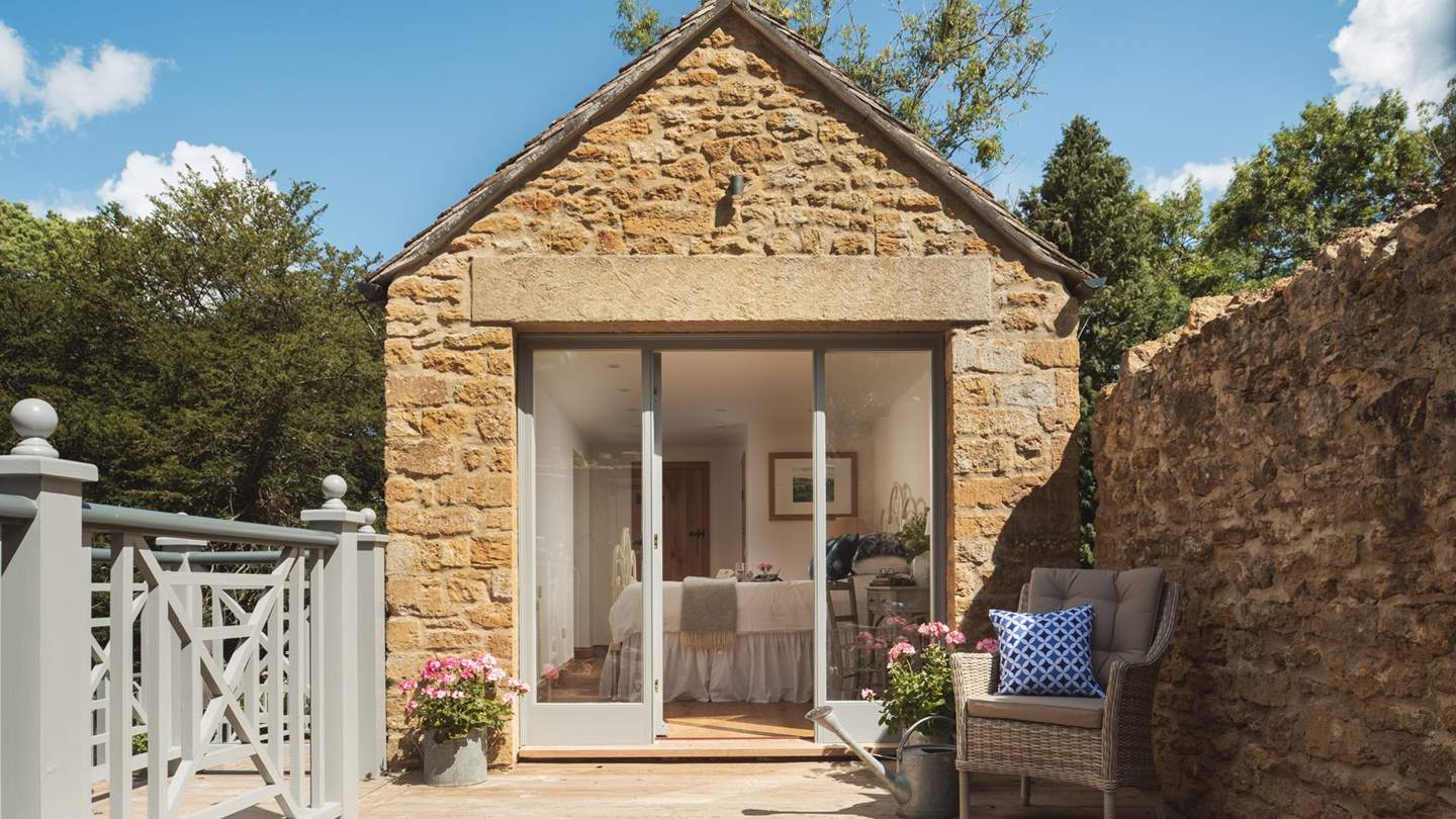 With full size glass doors and balcony overlooking the ponds, bedroom two is completely independent from the main house