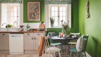We love the quirky, bright kitchen with its bright green walls and 50's feel
