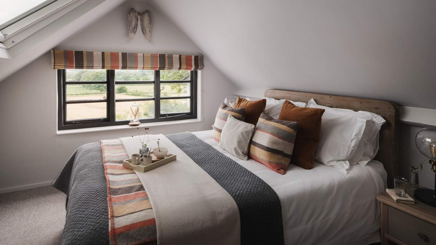 The sumptuous king size Loaf bed is covered with Egyptian cotton linens, luxurious throws, and lots of cushions to ensure the ultimate in comfort