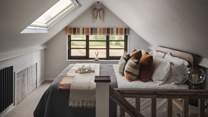 Nestled into the eaves of the upper floor, you'll find the sumptuous Loaf king-size bed