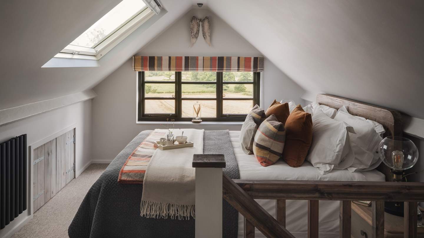 Nestled into the eaves of the upper floor, you'll find the sumptuous Loaf king-size bed