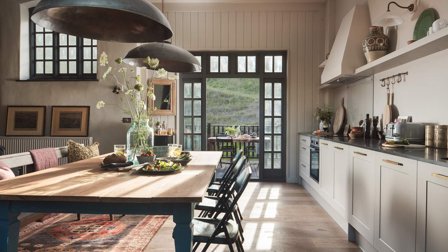 The fabulous kitchen which runs the length of the wall houses everything you'll need to rustle up your favourite meals