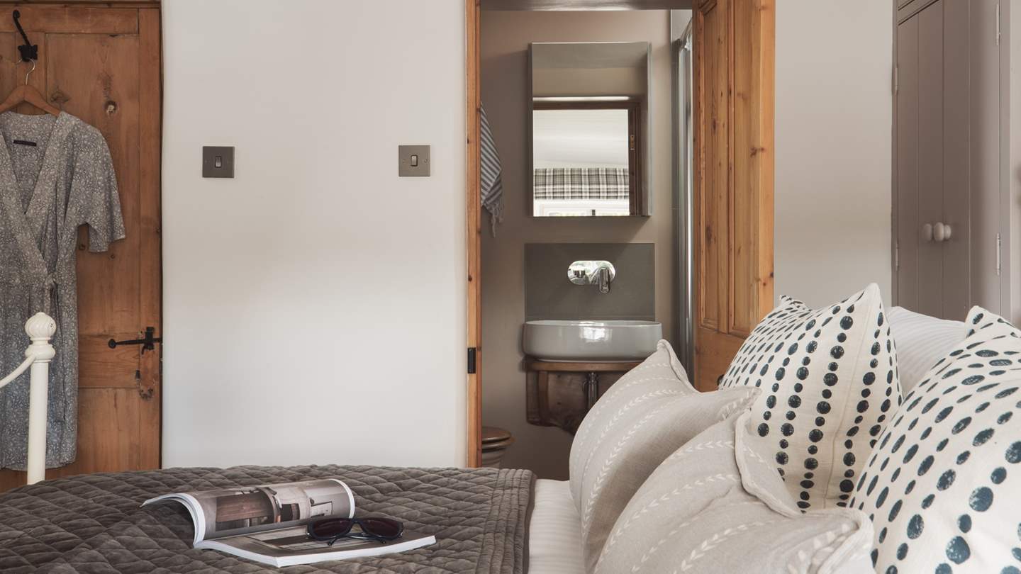 The master bedroom has an en suite shower room