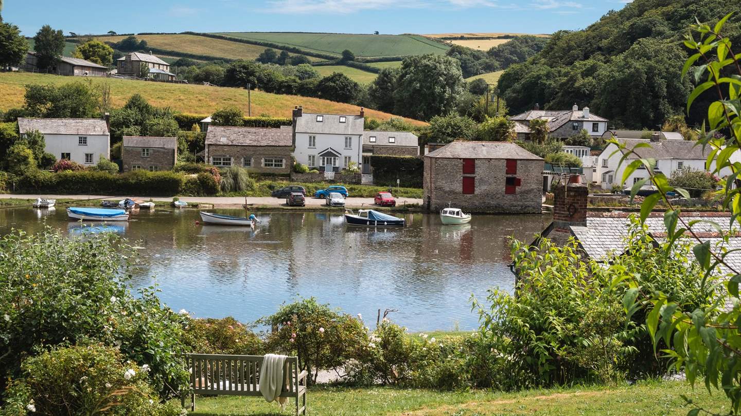 Delight in elevated views over the river from the lovely lawned garden 