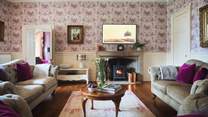 The gorgeous and cosy wood burner makes this room super snug