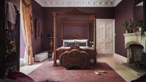 'Dove' is located on the ground floor and is an opulent bedroom in shades of rich berries and wine