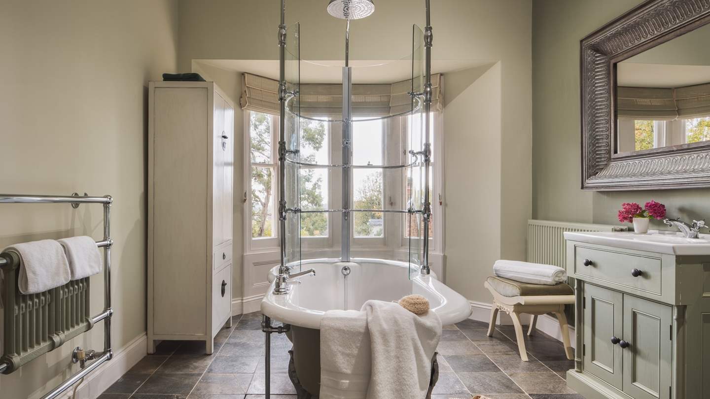 The main bathroom with incredible free standing bath and overhead rainfall shower