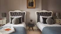 'Swan' is a darling twin bedroom situated on the first floor with glorious views over the garden