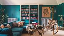 On the first floor, the second sitting room is chic in shades of teal, offering a super sumptuous velvet sofa for sprawling
