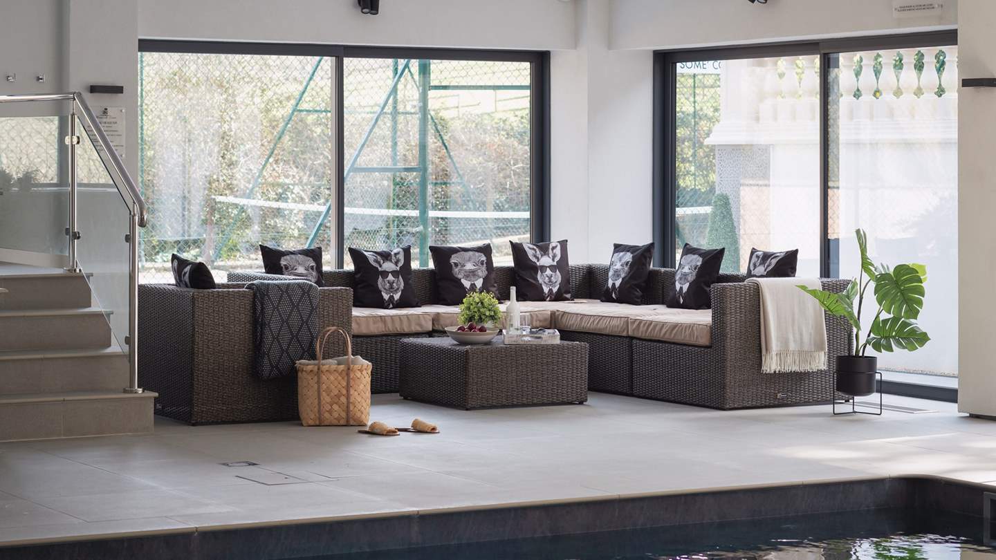 Recline poolside with a glass of something fizzy... 