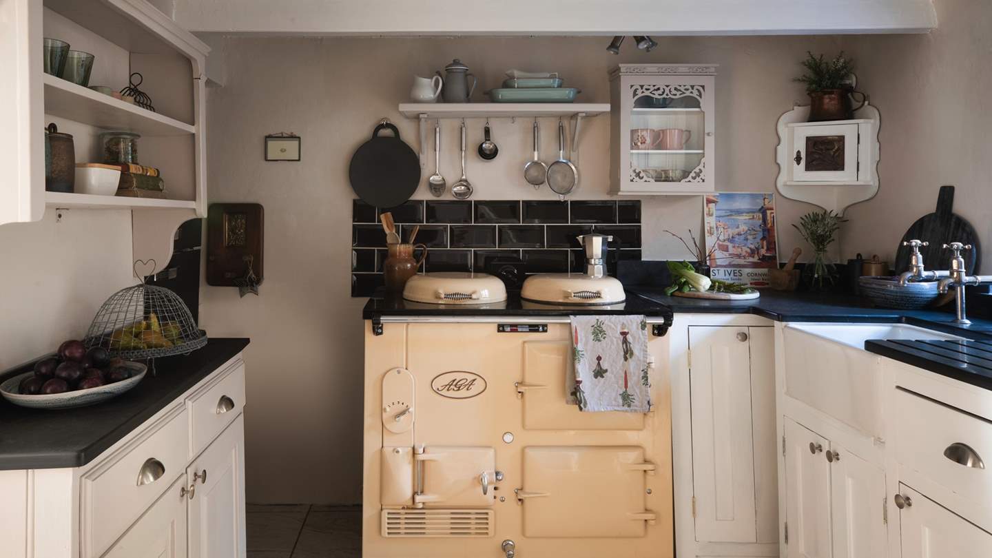 The gorgeous cream Aga is the heart of the home, where its warmth spreads throughout the cottage 