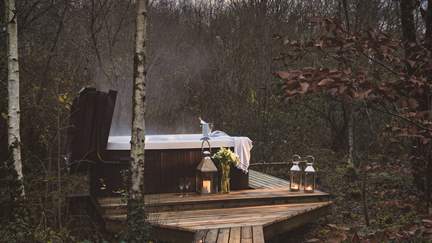 Follow the wooden slope down to the lower deck, and a sumptuous bubbling hot tub awaits...