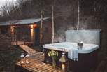 A bubbling hot tub makes this the go-to retreat for couples, friends, and families alike