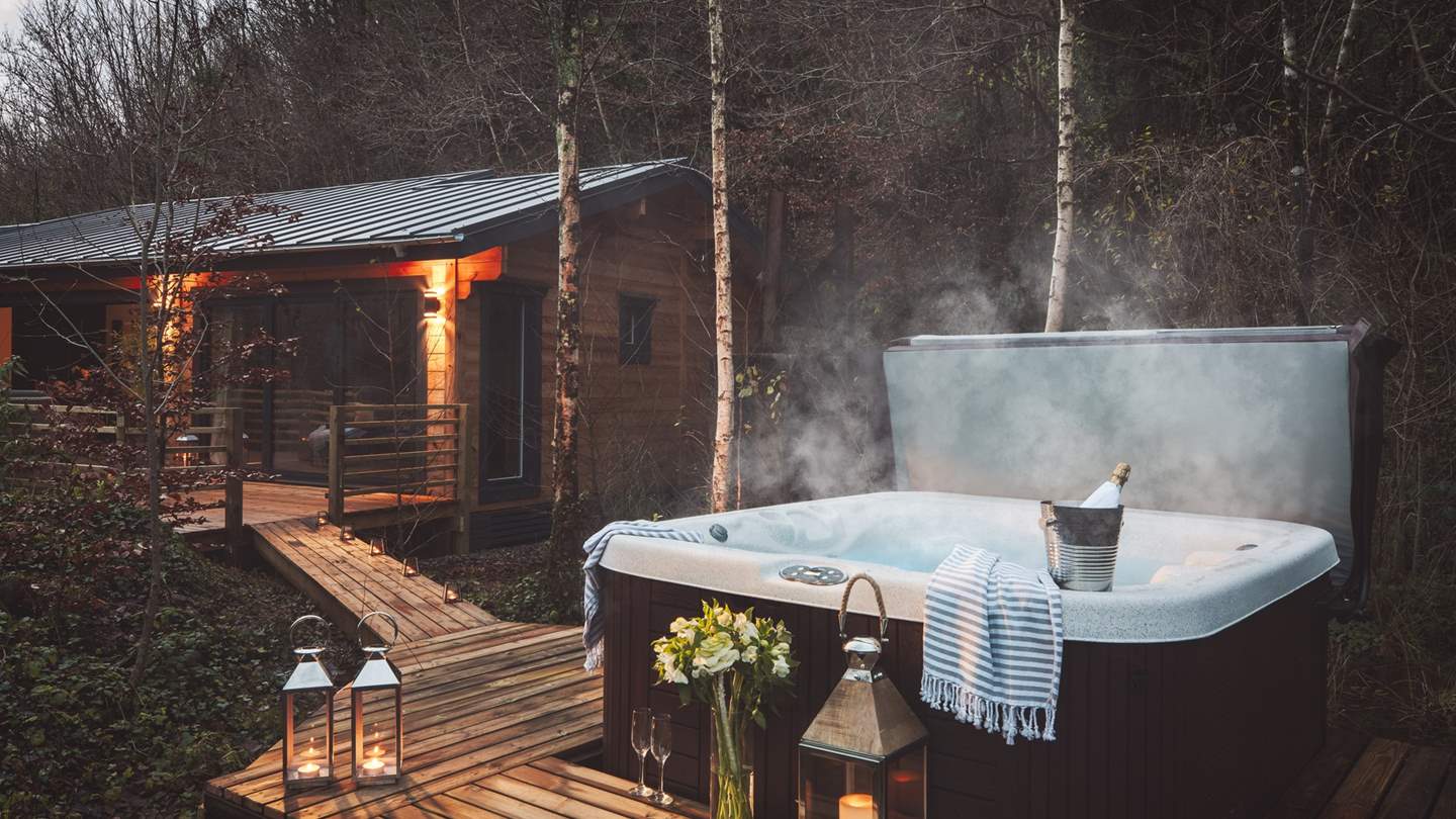 A bubbling hot tub makes this the go-to retreat for couples, friends, and families alike