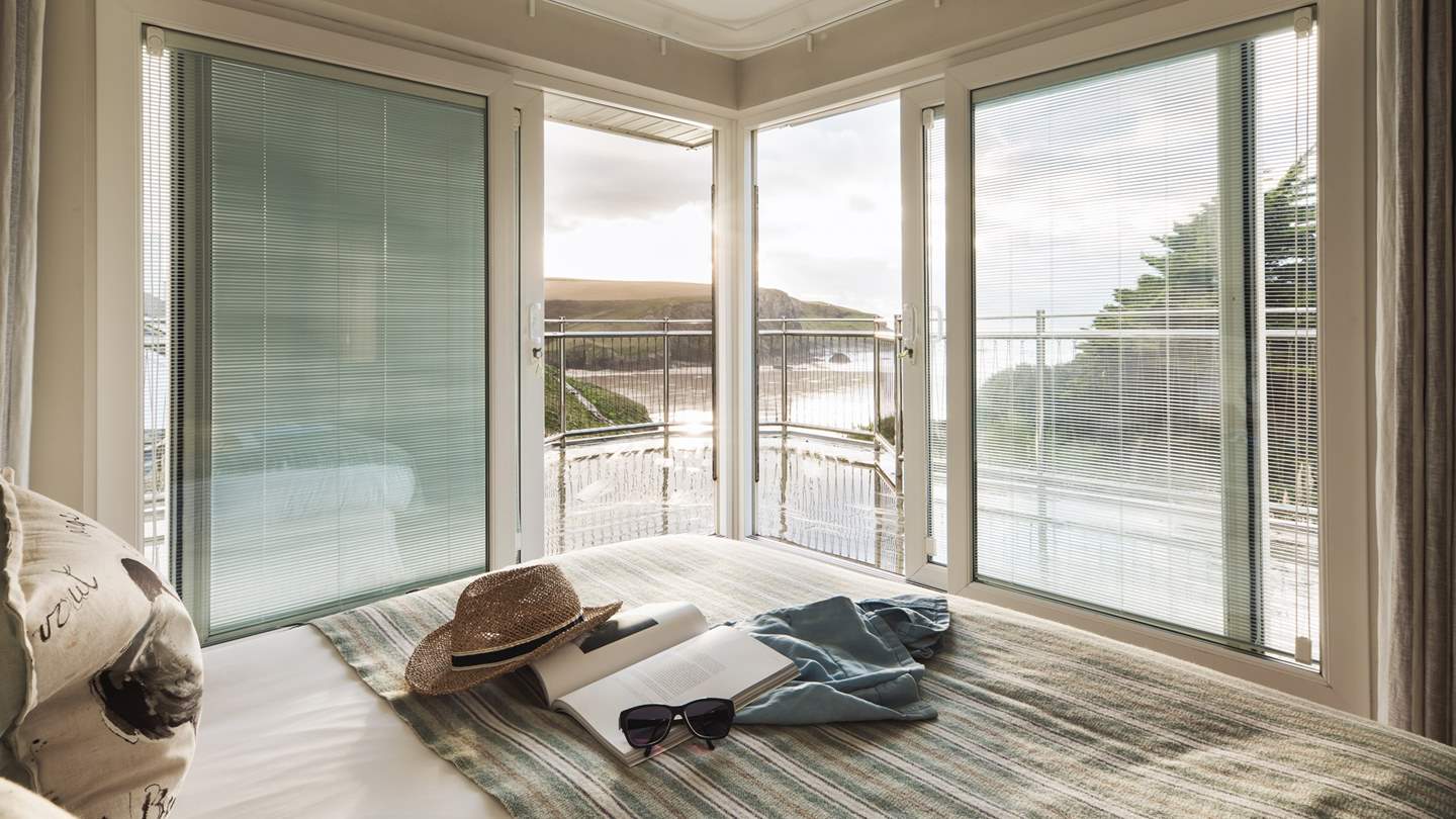 Just wow! Waking up to this view, and with a balcony too, makes this dreamy bedroom just perfect