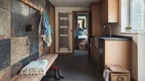 The boot room is the perfect space to store muddy boots and coats