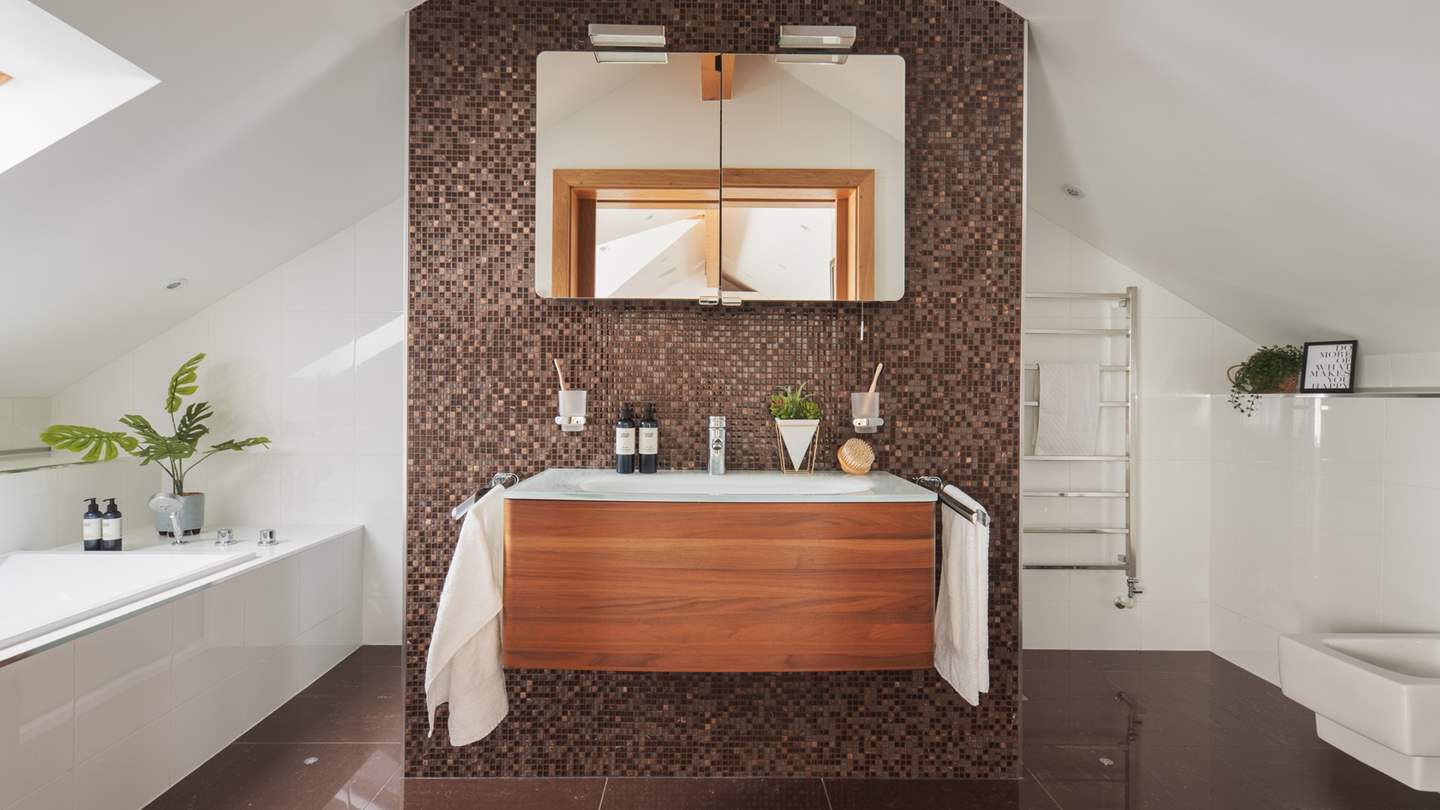 The glorious en suite, complete with immense walk-in shower, ginormous rainfall shower head and a lovely bathtub for two