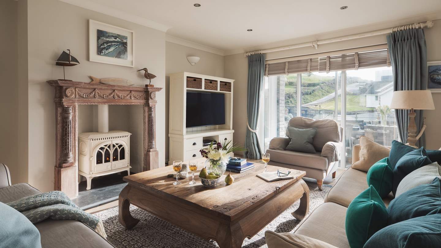 The stunning sitting room has a glorious wood burner at its heart, making it the go-to spot for cooler months