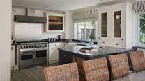 The kitchen is fully equipped with everything you could need to craft feasts for your loved ones, including a Falcon range cooker