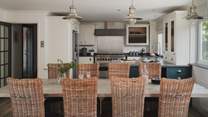 Uncover the spacious open plan kitchen and dining room, the heart of the home with views overlooking Mawgan Porth beach