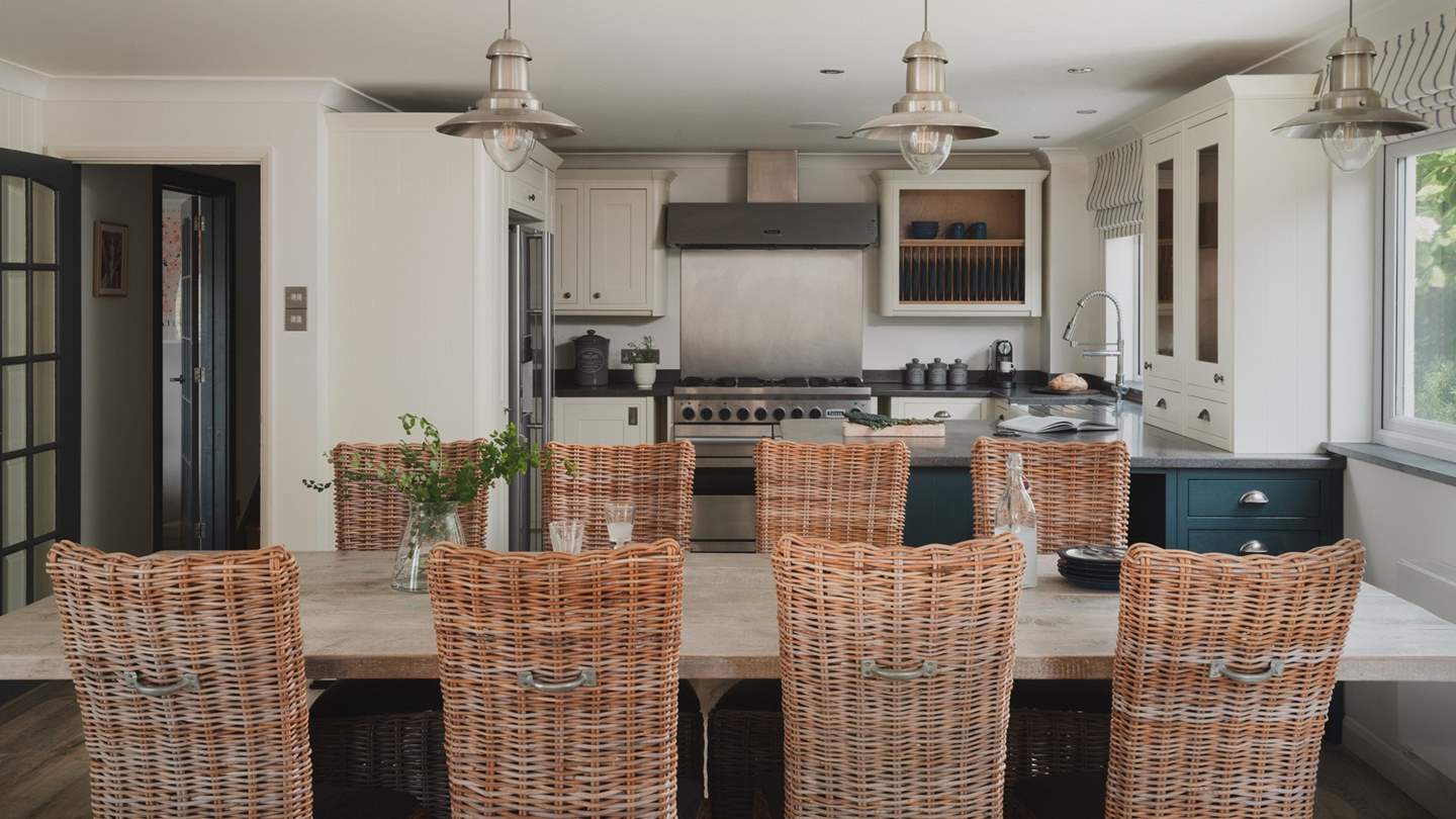Uncover the spacious open plan kitchen and dining room, the heart of the home with views overlooking Mawgan Porth beach