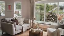 An additional seating area lies beside the dining table