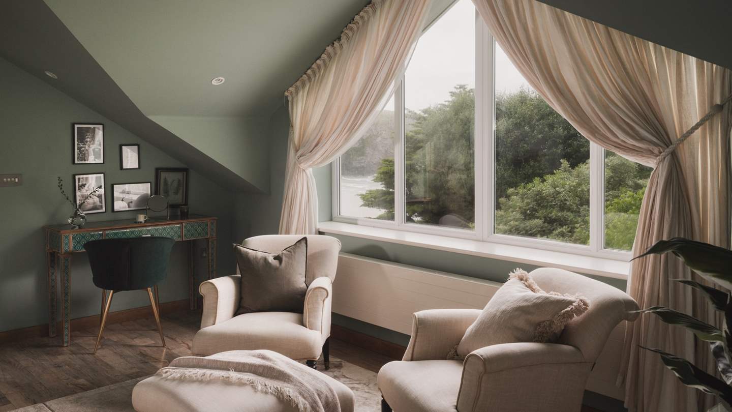 Wake up to charming sea views each morning in this calming bedroom