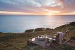 From the lower deck, steps lead down into the cliff top garden where the fire pit is a must for  watching the stars twinkle above 