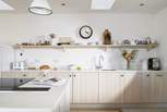 Diffused with soft light, the kitchen is an interior designer's dream