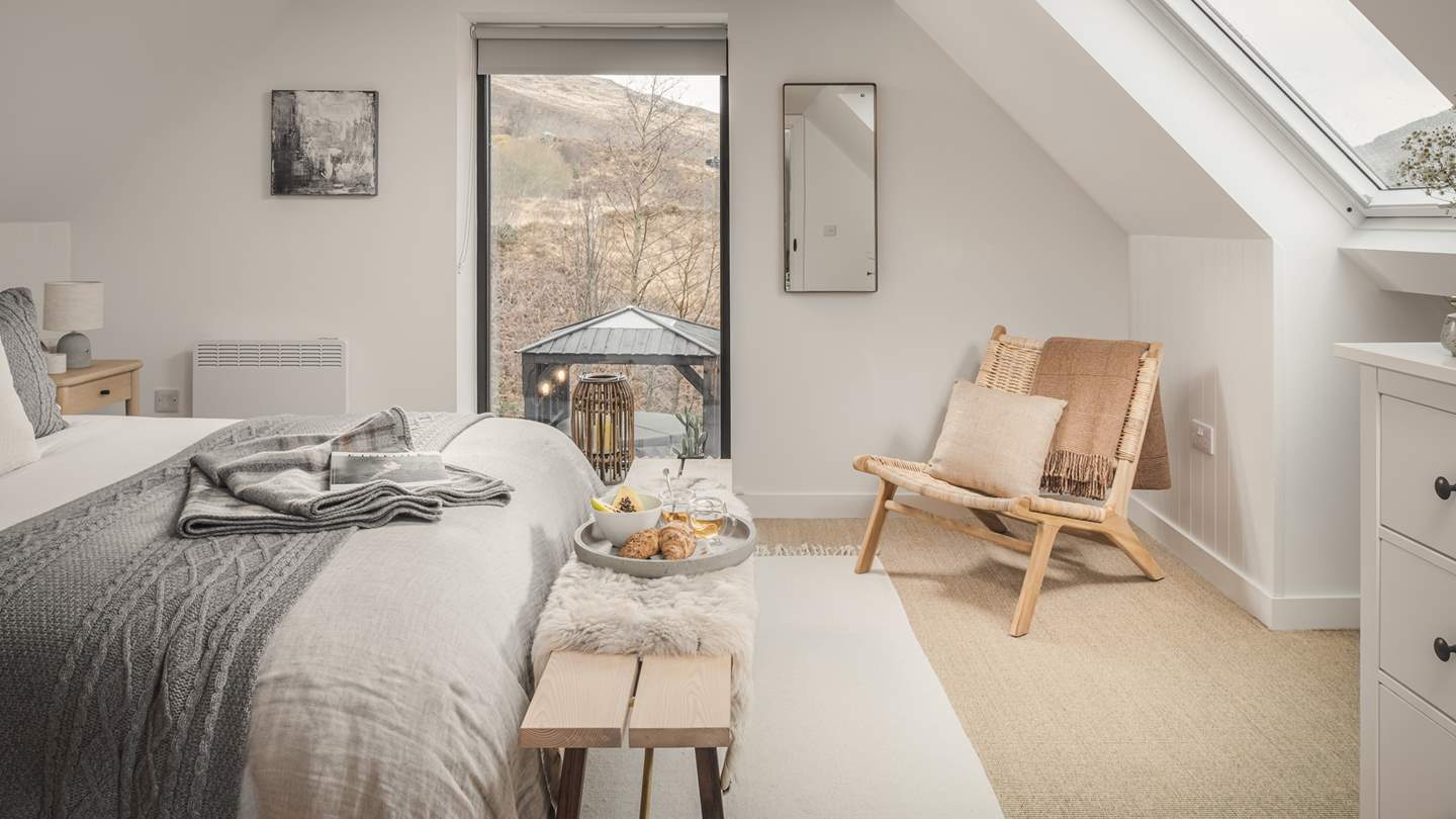 Both bedrooms have occasional chairs, hanging space and a chest of drawers offering plenty of storage