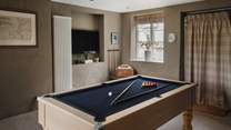 Discover the games room, complete with a Smart TV, pool table, table tennis and dart board