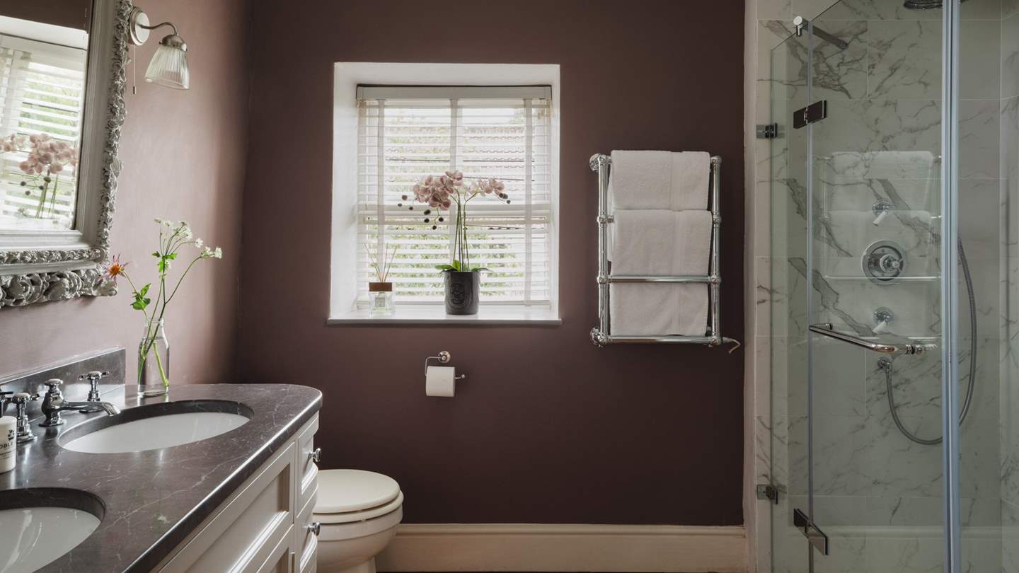 Discover the en suite bathroom, with a shower and heavenly copper bathtub