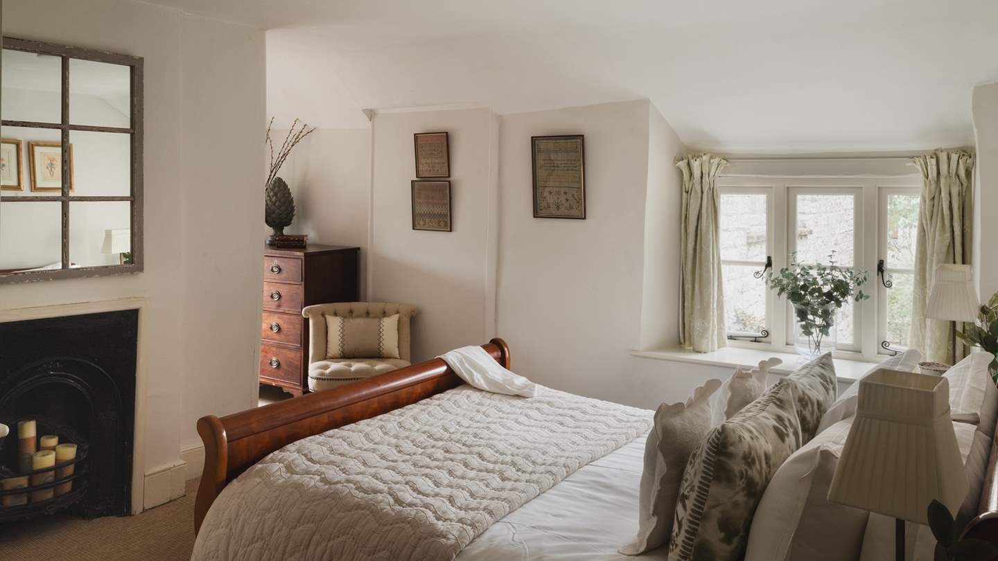 This bedroom invites for blissful slumber, dressed in soothing neutral tones