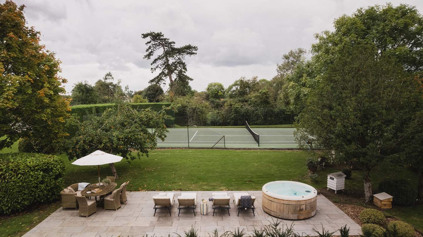 Outside, the garden is large enough for dogs to roam and little ones to play