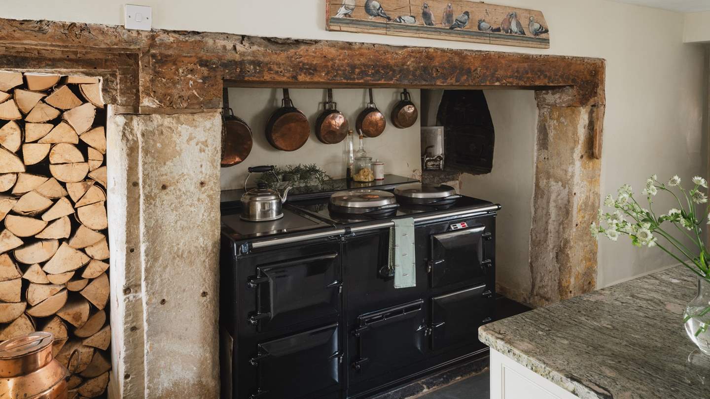 At its heart, the four-oven Aga lies nestled within the large inglenook fireplace