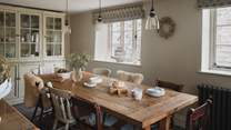 A rustic table seats up to eight