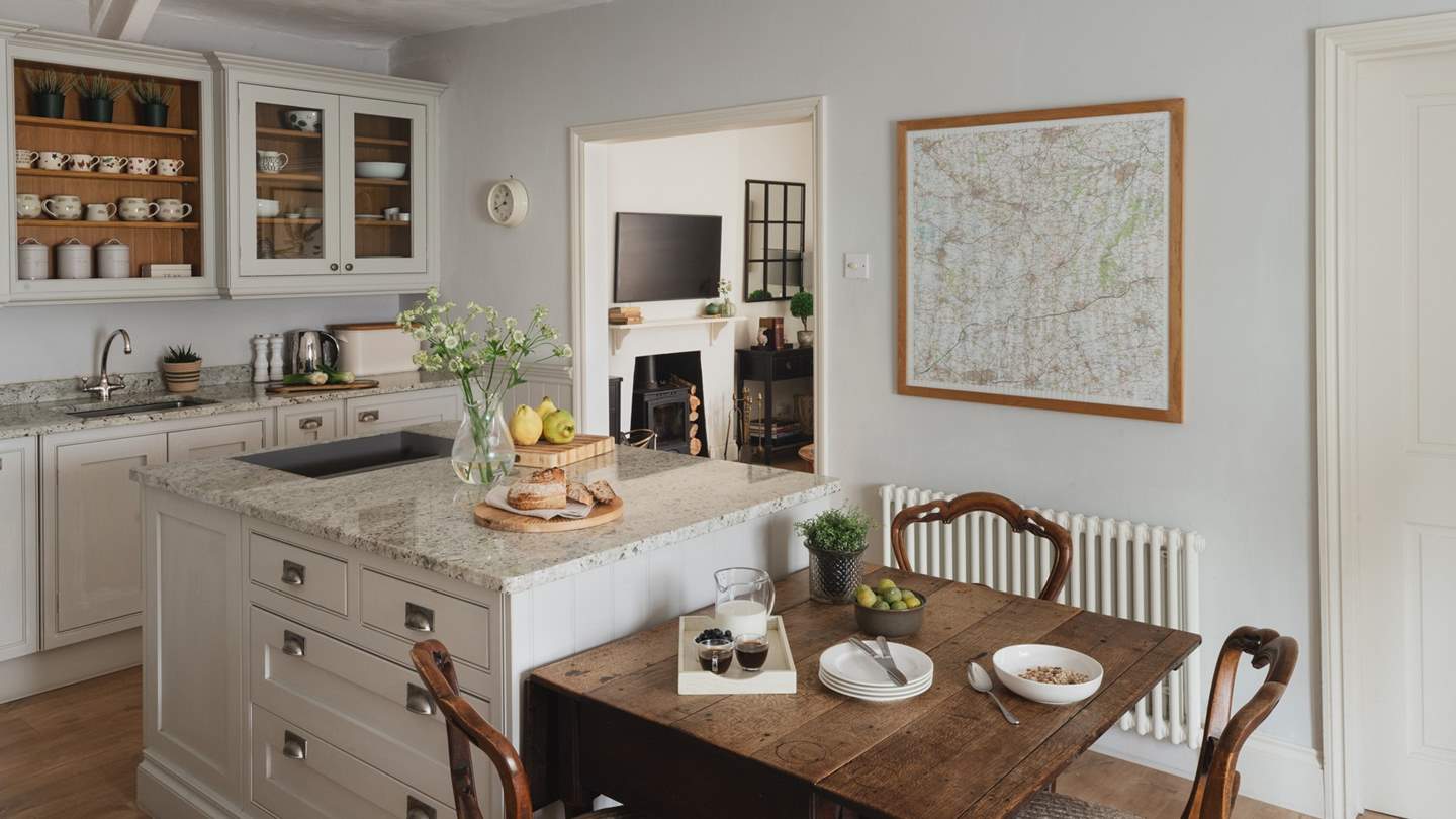 You'll find a dining table here too, whilst outside you can eat alfresco at the large teak refectory table or in the outside covered seating area