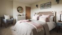 The pretty king-size bedroom - we just love the dusky pinks