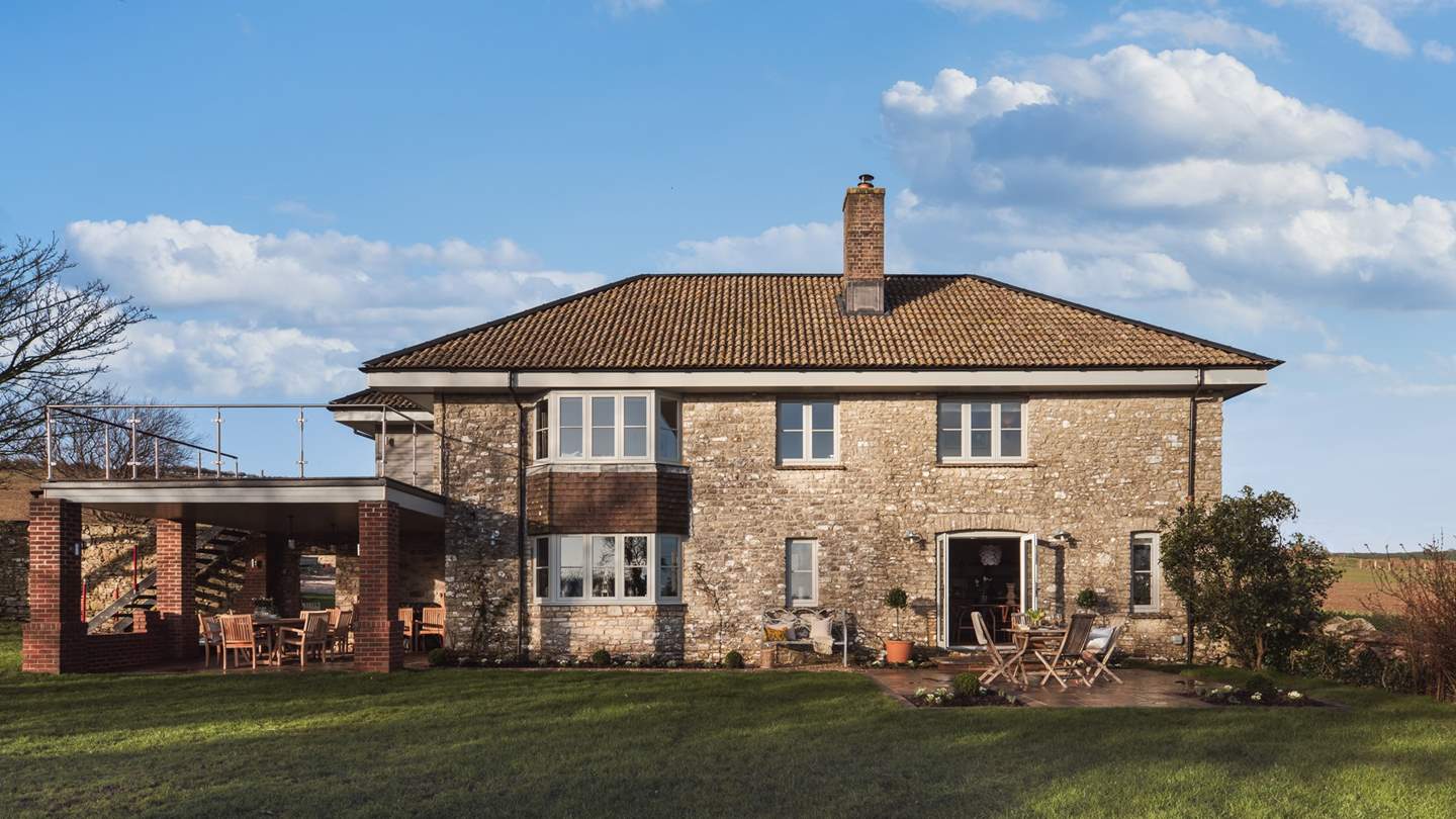 There's an expansive lawn which is perfect for children to play and dogs to roam